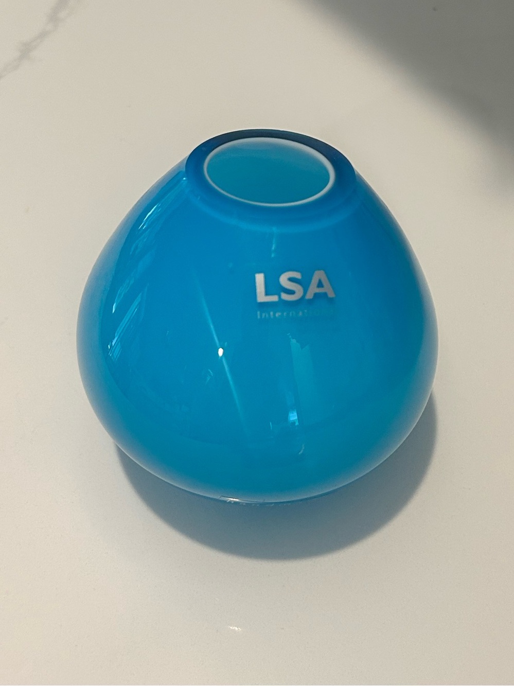 LSA Turquoise Blue Round Glass Bud Vase, measuring 3” tall, 3.5’
acres base.